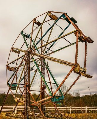 Every time I pass by this place I say I need to stop. The last time I did the gate was closed and locked, so I couldn't get inside, but this time the gate was open.
You can see it from the expressway. It used to be a gas station and fireworks store, but now it is just an empty lot with a couple old ferris wheels and other carnival equipment. It is very eerie and beautiful though, if you see it I'd stop and walk around a minute.