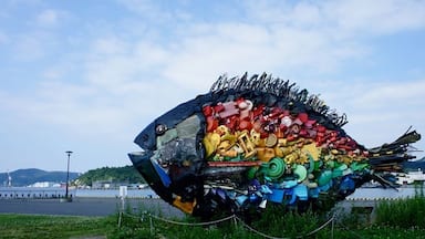 Big fish, made from garbage, near the port