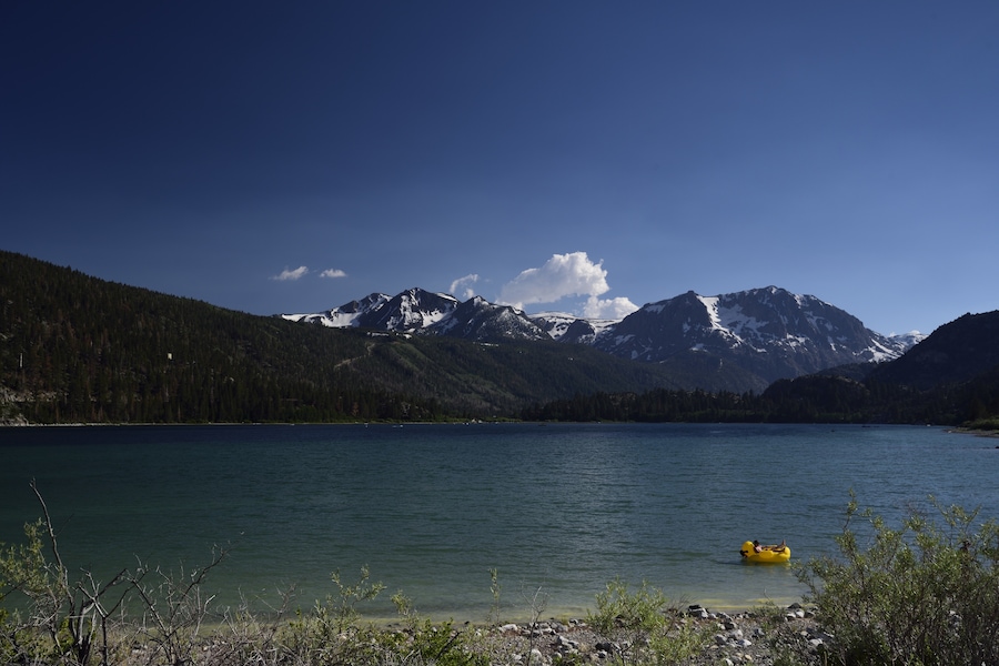 Serene and calm with a great view of mountains across the lake.