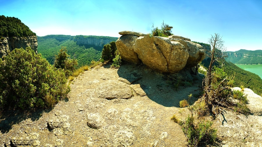 Viewpoint in mountains where you can see the dam Santa Pau. Before the dam was built, there had been villages in the valley - the buildings still remained under the water!