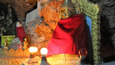 A pleasant walk through the mountain town of Kalaw brings you to Shwe Oo Min Paya, a series of caves filled floor to ceiling with buddha statues, lights and scribblings. 

It's not a hard walk to do - simply state your destination to any local nearby and they'll point you on your way until you reach the spot! #red