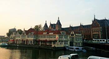 The enchanting city of Amsterdam. The lovely old buildings and restaurants on the banks of River Amstel. 