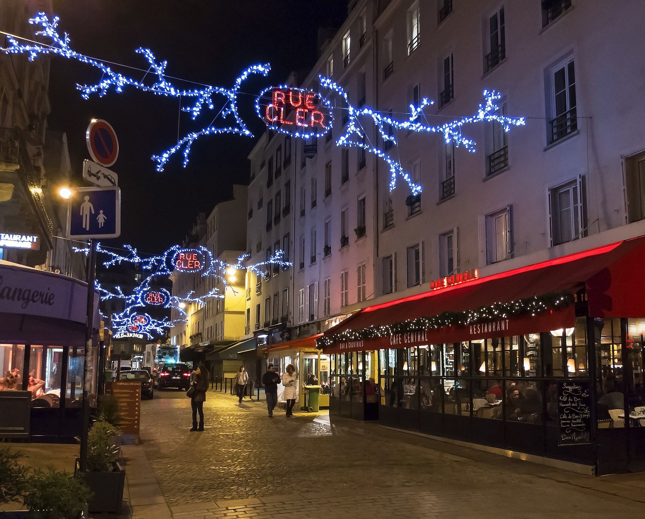 Holiday lights decorate Rue Cler.  Rue Cler is a great little Paris neighborhood with daily morning market and a number of excellent dining options.