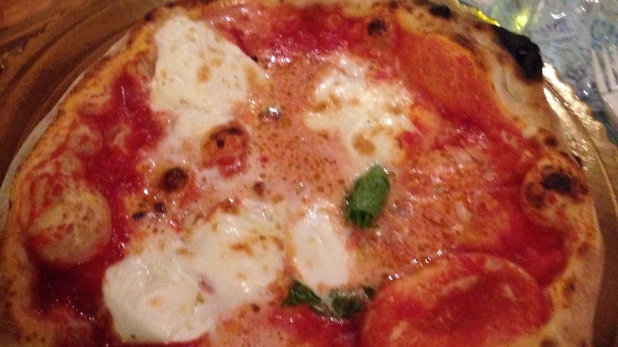 Hands down best pizza I've ever had. It's a tiny place, so you'll have to wait for a table, but they try and seat you as fast as possible. We shared a table with a few other people, which made for an even better experience!