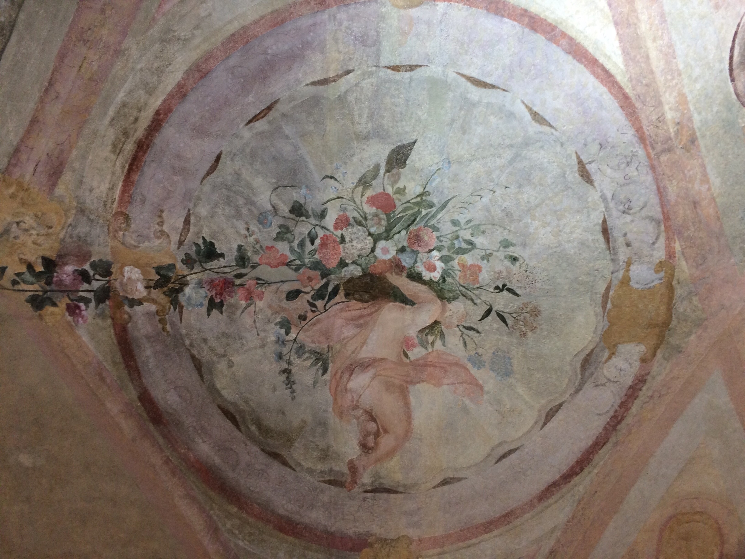 Southbound view of a cherub. Ceiling detail, Sternberg Palace.