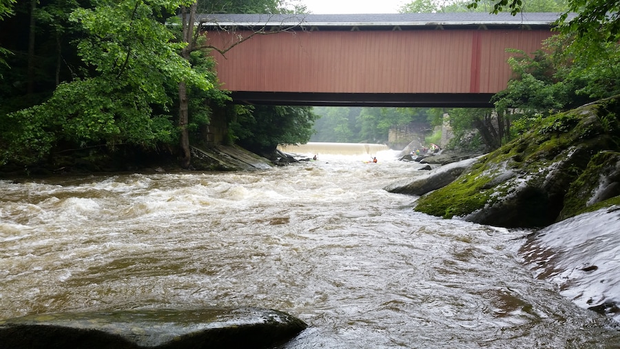 Down river from the bridge. Easy access to the state park.