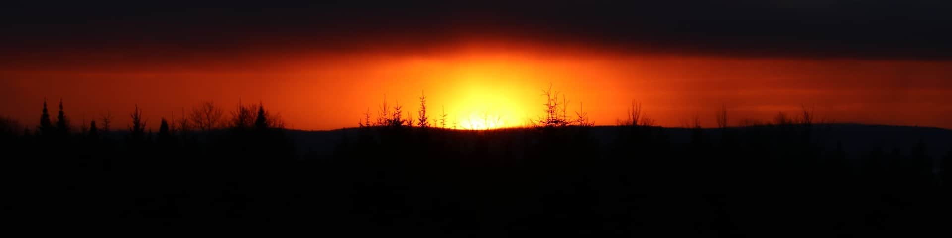 Small hill on Aroostook Road (Route 11) overlooking a valley with awesome sunsets.