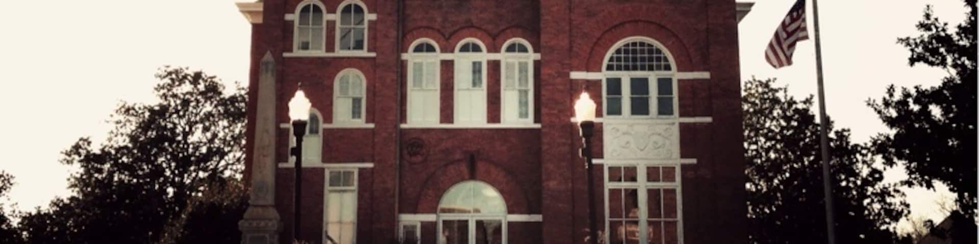 Talbot County was created by Act of December 14, 1827 from Muscogee County. It was named for Matthew Talbot (1767-1827), member of the legislature, member of the Convention that framed the Constitution of Georgia, President of the State Senate, Governor in 1819 after the death of Gov. Rabun until the election of Gov. Clark. First officers of Talbot County, commissioned February 9, 1828, were: Abraham Laurence, Sheriff; Samuel C. Leech, Clerk Superior Court; William S. Goss, Clerk Inferior Court; Benjamin Loyd, Surveyor; Hubbard Brown, Coroner.