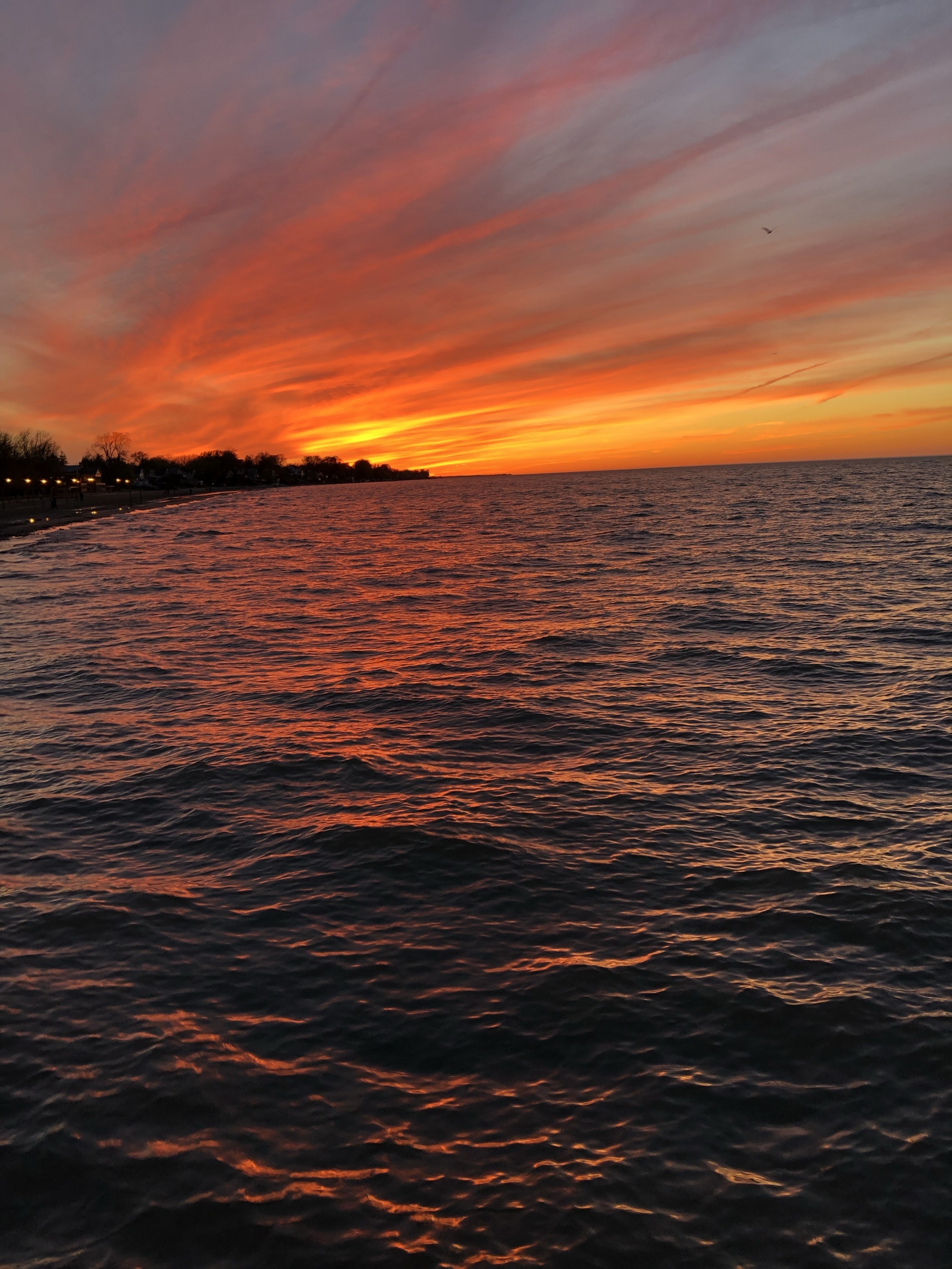 Watching the sunset from a pier in Lake Ontario near Rochester, New York #Adventure #sunset #LakeOntario #Lake #NewYork