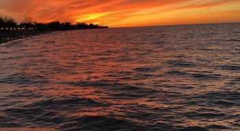Watching the sunset from a pier in Lake Ontario near Rochester, New York #Adventure #sunset #LakeOntario #Lake #NewYork