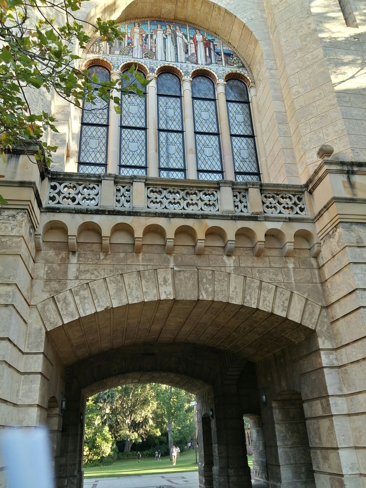 A very European archway at the University of Western Australia, with very Australian bushes beyond!