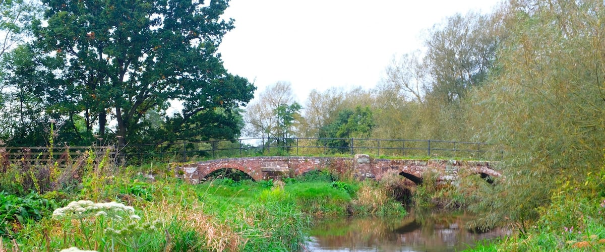 A listed building  across the river built in the 15th century