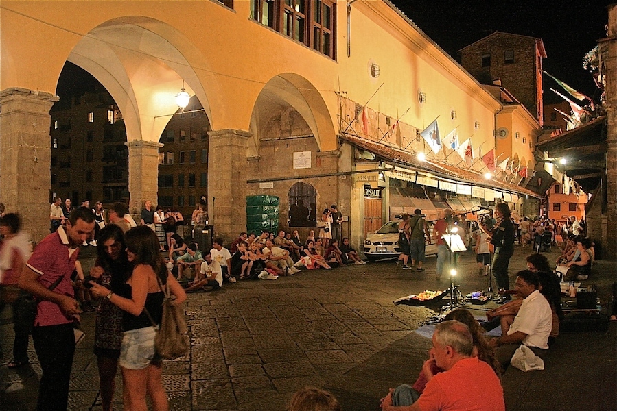 Taken at night while troving around Florence. I decided to chill like the rest of the crowd and sat listening to the musician playing the guitar and singing. He did a good job at entertaining us.