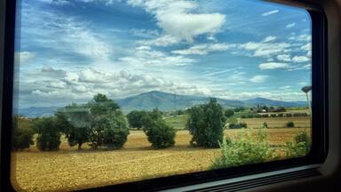 Looking out the window on a fast train ride to Florence from Rome...