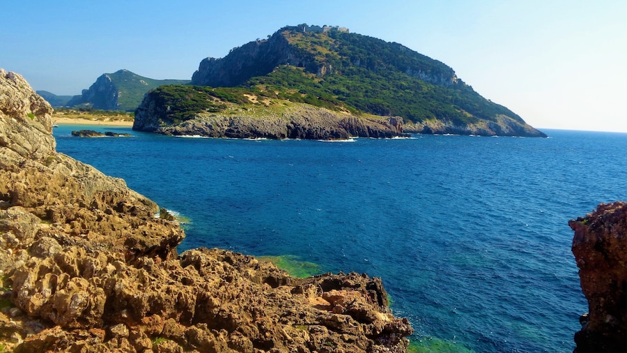 I took this photo in Messinia, Greece in summer 2016. It's of Voidokilia Beach and it's surroundings. Voidokilia Beach is on the Peloponnese peninsula and it was the most picturesque beach that I visited during that Greek trip, which was almost exclusively in Messinia. On that mountain is Nestor's Cave and above this are the ruins of a 13th-century Frankish castle