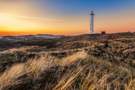 Lyngvig lighthouse, Hvide Sande, Denmark 

Really nice location for a sunset trip. Easy to get to and not very over run by people. 