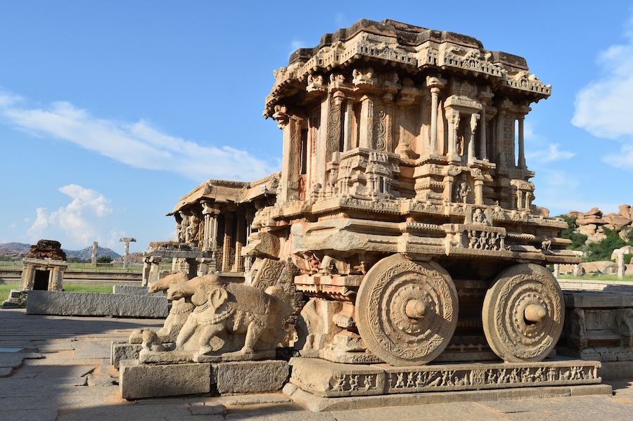 This iconic chariot housed within the Vithala (another name for Lord Vishnu) complex was built in the 15th century by King Devaraya. This complex is a must visit on every Hampi itinerary. Appreciate the craftsmanship of the towering gateways, intricately carved pavilions and structures and the unique musical pillars.