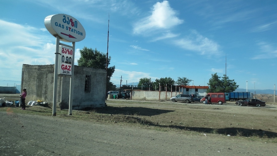Sign for a gas station. View from a roadside stop in the town of Marneuli, Georgia.