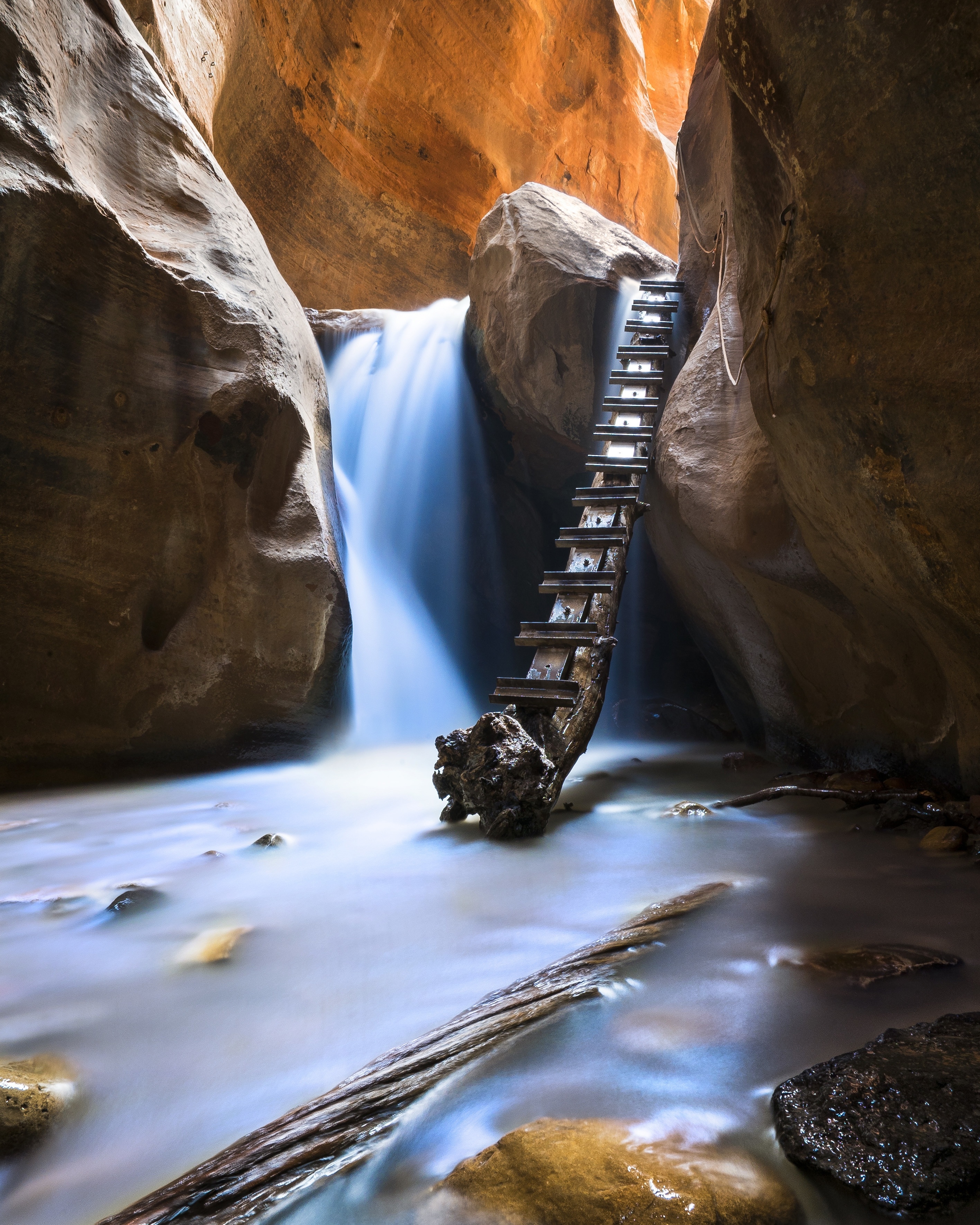 About one hour north of Zion National Park, Kanarraville offers a small slot canyon  accompanied by tree ladders & rope climbs leading to dramatic water cascades. #ADVENTURE