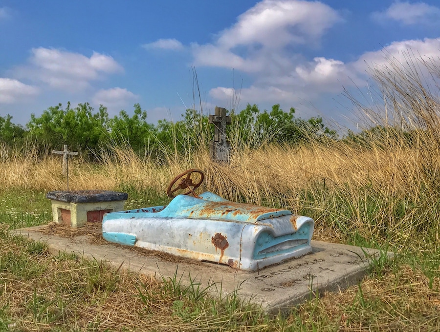 Cool to see a "toy" car atop the slab at a gravesite