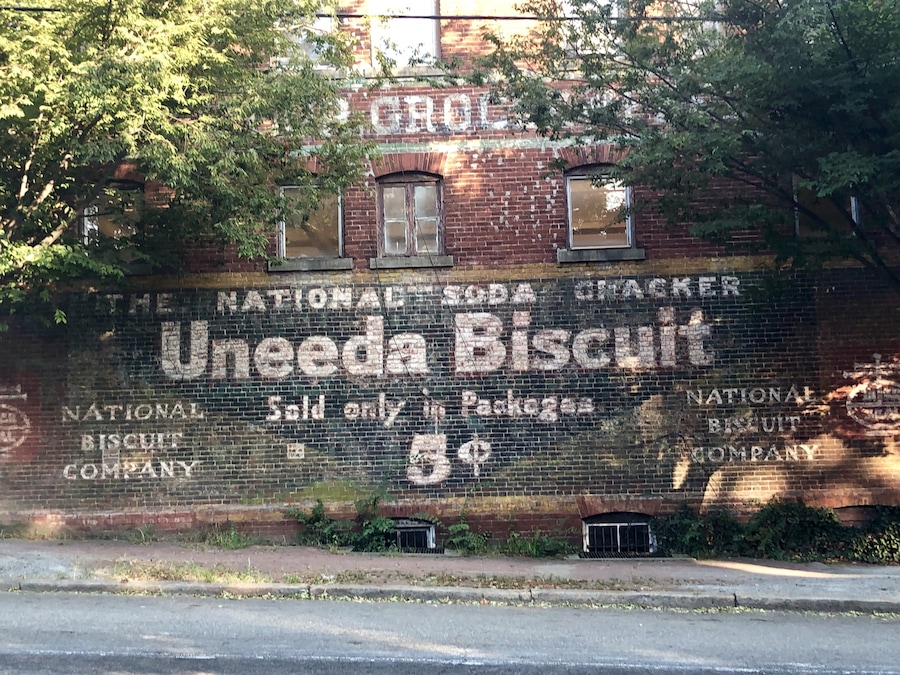 Advertising from days gone by on the side of a building across from St Johns Church.