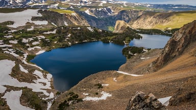 If you plan to visit Yellowstone and then drive to Badlands or Mt. Rushmore or Devils Tower National Monument, I can highly recommend to take a little detour and drive the Beartooth pass, starting in the north east of Yellowstone in Cooke City. It is one of the most scenic drives in the US. 
The photo here shows the Twin Lakes.

#GreatOutdoors
#OnTheRoad
