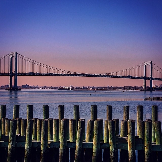 One of the best views and lesser known areas in New York.  Sunset behind the Throgs Neck Bridge from Queens, Fort Totten State Park #travel #nyc #sunset