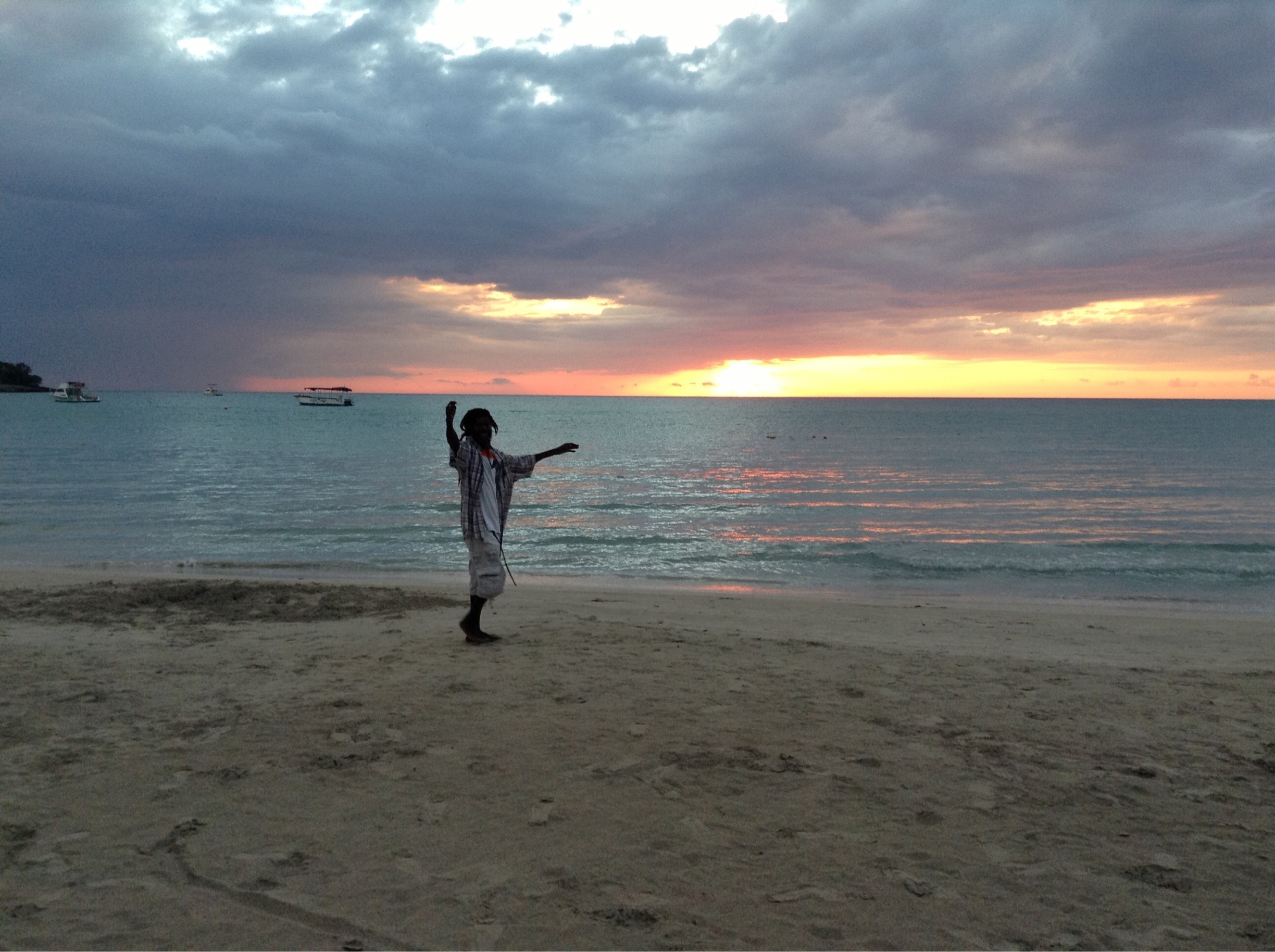 A chance shot of a local Rasta enjoying life in Negril. I was actually trying for the sunset. 