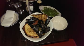 The mussel appetizer here is PLENTY for one person's entree, and sooo tasty. It has some kick with spicy chorizo and jalapenos. They serve a big helping of hearty bread to soak up all the browth. Great beer list here too.