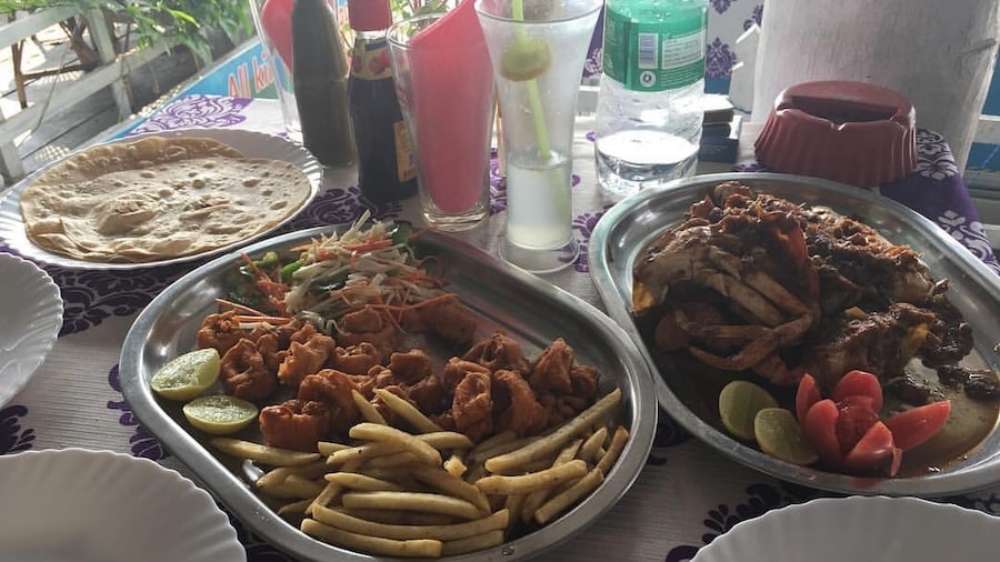 Golden Fried Calamari with fries and salad, crab in special kerala masala, butter naan, and steamed rice ❤️❤️#kerala