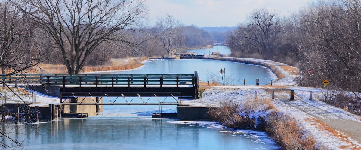 This is a photo from the top of a bridge showing the tiered lock system flowing west to east on the Hennepin Canal.  From the feeder canal in Sheffield, Il, the water flows east to west AND west to east from the center of the pool.  Difficult to explain:)