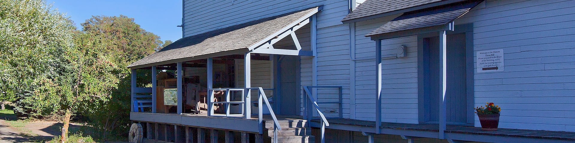 This grist mill was built in the 1880s and operated as a feed and flour mill until 1946.  The area was first developed ten years earlier when James Mills dug a 2-mile (3.2km) ditch from the Yakima River to create a log pond and power his sawmill.  The grist mill was powered by the same outflow, and with the arrival of the Northern Pacific Railroad in 1886 and Milwaukee Road in 1908, the mill was able to sell it's products nationwide.
In addition to the sawmill and grist mill the owners added an ice pond in 1889 to service the Northern Pacific.  Between this pond, and the larger Sprague Lake, over 40,000 tons of ice could be packed into hundreds of refrigerated cars each year.  Using sawdust to insulate the ice, they were able to supply the railroads all the way through to the end of summer.
Today the grist mill serves as a small museum and a reminder of human ingenuity and capitalism. The turn-of-the-century equipment inside has earned it a place on the National Register of Historic Places.