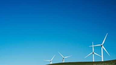 Wind turbines spinning around majestically 