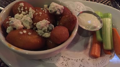 Yummy potatoes with hot sauce and blue cheese.  