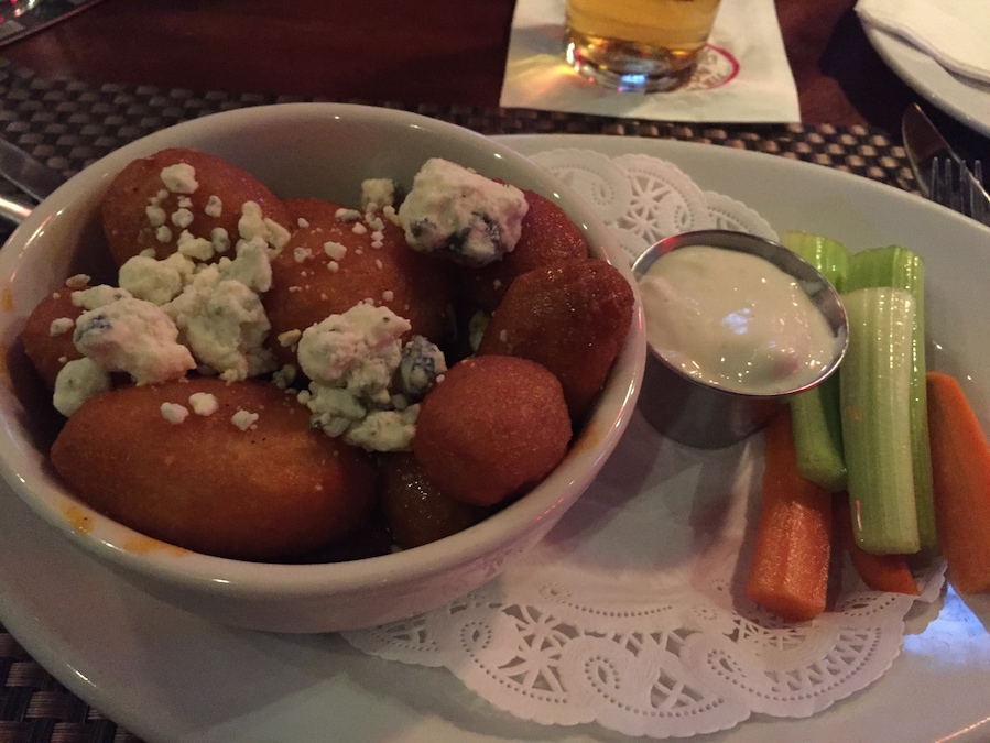 Yummy potatoes with hot sauce and blue cheese.
