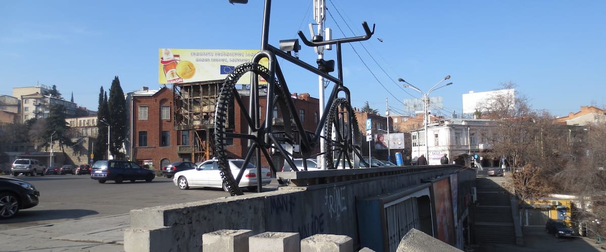 Large bicycle statue in the city of Tbilisi, Georgia.
This piece was done by a French artist named Jean Dupal. The newly elected mayor of Tbilisi vowed to have this structure removed as soon as possible. He claimed that the structure didn't fit in at all with the decrepit Soviet-era structures in the area.
After a considerable bit of protest on social media, plans to remove this structure look to have been delayed - though I wouldn't be surprised if this structure is removed in the middle of the night at some future point.