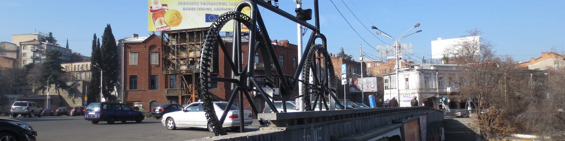 Large bicycle statue in the city of Tbilisi, Georgia.
This piece was done by a French artist named Jean Dupal. The newly elected mayor of Tbilisi vowed to have this structure removed as soon as possible. He claimed that the structure didn't fit in at all with the decrepit Soviet-era structures in the area.
After a considerable bit of protest on social media, plans to remove this structure look to have been delayed - though I wouldn't be surprised if this structure is removed in the middle of the night at some future point.