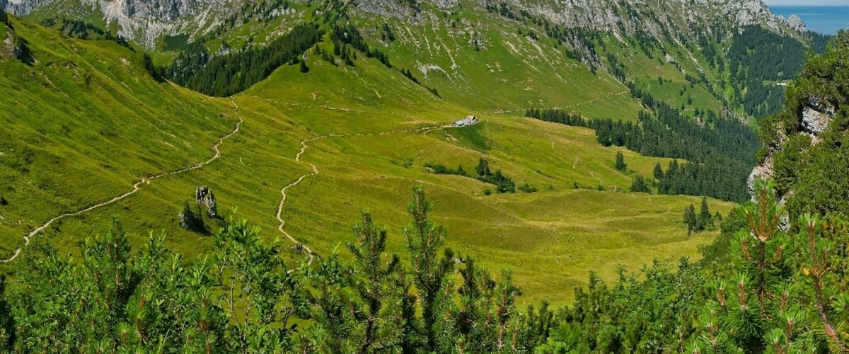 July 2015
Tannheimer Berge 
Koellenspitze (2.238 m) , Schneid (2.009 m) and Gehrenspitze (2.163 m) as seen from the route to Hahnenkamm from the cable car station near Reutte in Tyrolian Austria. 
These summits belong to Tannheimer Berge (mountains) which are part of the Allgaeuer Alps.