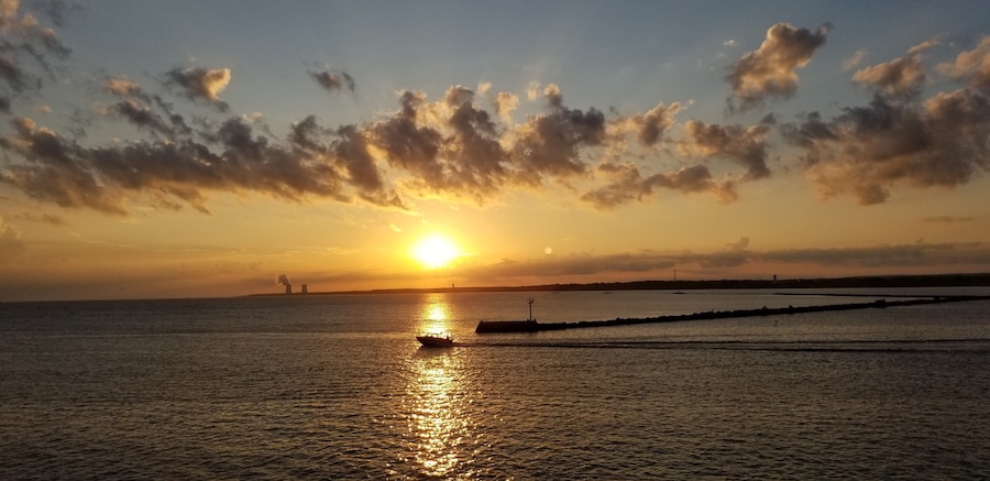 Every morning, when the weather is warm, just as the sun is rising, fishermen head out Lake Erie to fish for locally prized perch and walleye. This photo captures that morning ritual.