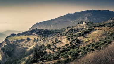 Just after the mountain top villages while on the way from Heraklion to Malata I saw this amazing view with what I believe is a farmhouse on the edge of a cliff.. Would likely be even better during sunset.

(I'm not 100% sure exactly where #ontheroad this view is so placed the marker where I think it was)