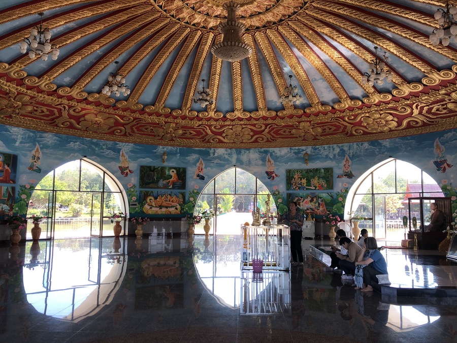 The interior of the lotus shaped temple in the middle of the pond