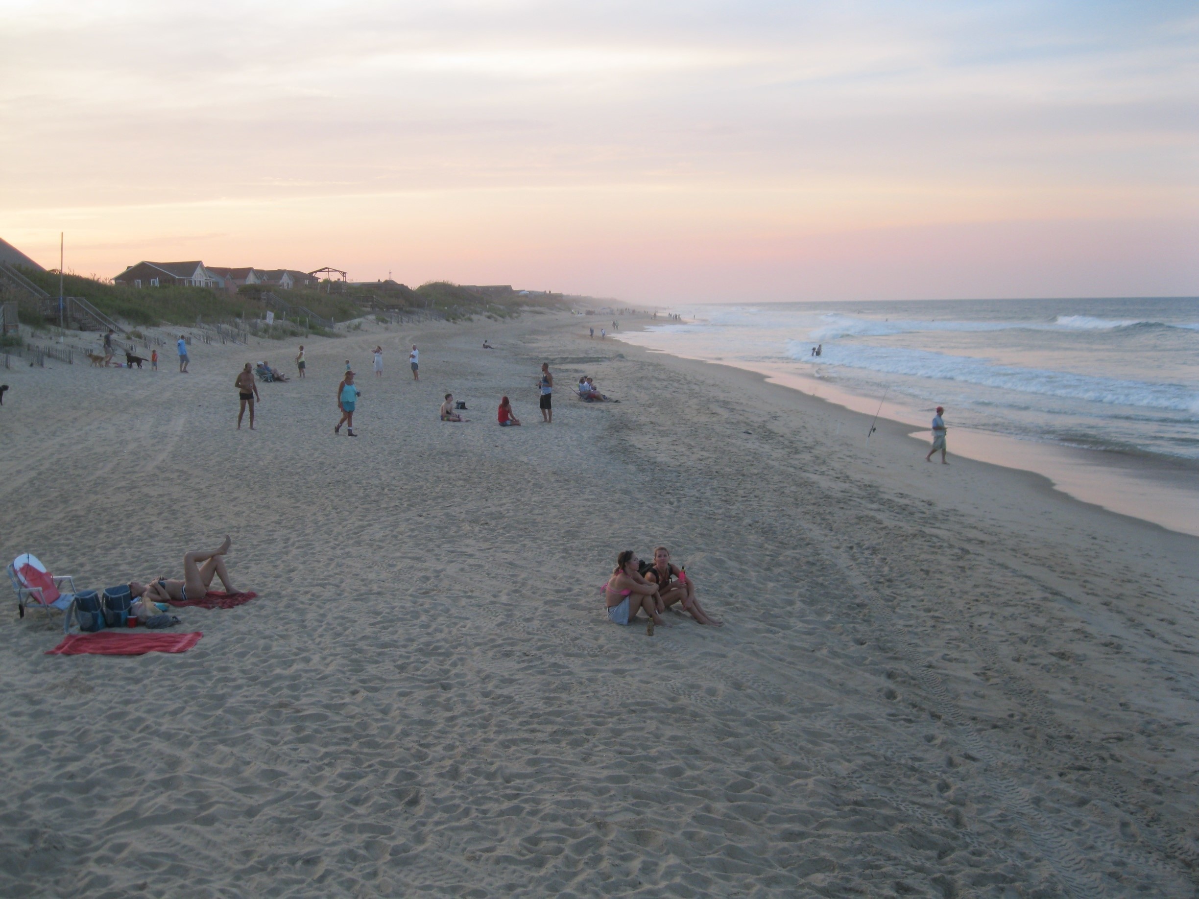 View of late afternoon beach crowd, while dining outdoors at the Nag's Head Fishing Pier.