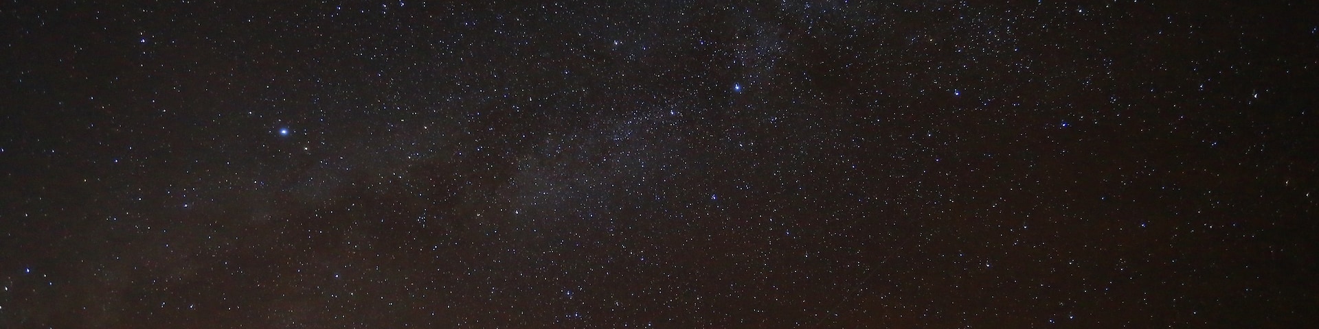 The Visitor Information Station (VIS), at the 9,200 foot (2,800 m) level of Maunakea, has a free nightly stargazing program held every night of the year from 6:00 pm until 10:00 pm. Reservations are not needed. The program begins at 6:00 pm with the showing of First Light, a documentary about Maunakea made by PBS Hawaii about the history of the mountain from both astronomical and cultural perspectives.
There are tours to take you up the summit but we did not have the time for it. Also the Information Station was pretty cold around 40F. It`s also super windy. There are restrooms available. Please do NOT use flashlights or cell phones as it disturbs the Star Gazing Program. As the Information Station is pretty close to the parking you would have frequent brake lights and head lights coming on and off, so I had to wait a really long time to get this shot. 
As soon as the sun sets, the magic begins...The entire sky is lit with stars that shine like diamonds...Its surreal that you can almost reach out to touch them. I had been wanting to see the milky way for so many years and when I actually saw it with my naked eyes...I was acurely aware of the beauty of creation. I felt ALIVE!