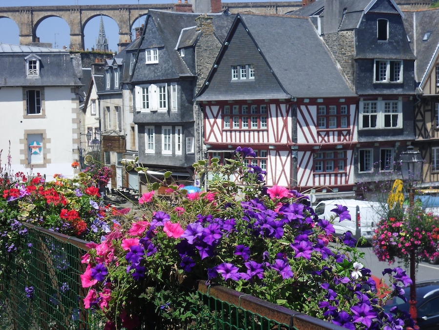morlaix, Brittany in the summertime. Interesting, very histric with medieval buildings. There is an estuary with yachts and a magnificent viaduct which you can walk across to maximise views. Well worth the climb!