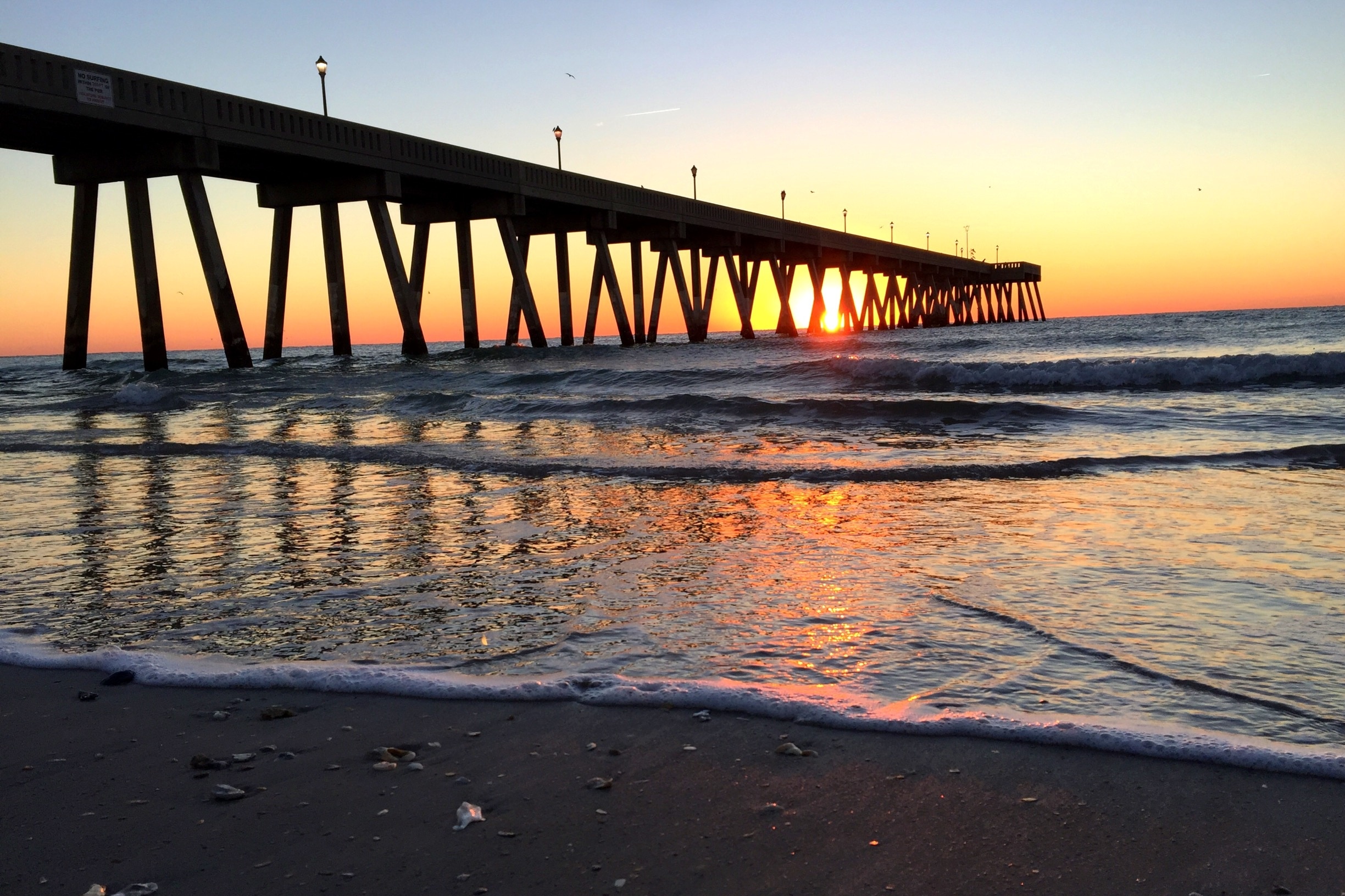 This pier makes for great sunrise photos. $2 to walk out onto it but totally worth it. Lots of avid fishermen to entertain you AND they sell beer and other beverages to carry out there with you. The Wilmington/Wrightsville Beach is a great area to visit with numerous excellent breweries and many great restaurants. 