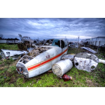 Aircraft junkyard at the Mexia-Limestone County airport in Texas. I stumbled upon this place while driving back into Texas from Oklahoma.
There is a company here that salvages old and new aircraft. They have a decent sized junk yard that you can wander around, full of oldish planes that have been scrapped or being used to restore others of the same type. There was an old boy hanging around while we were there who allowed us to walk around. He also was very friendly and talked to us about the company and his three tours of Vietnam.
A small gem of a discovery for aviation buffs and HDR photo freaks alike!