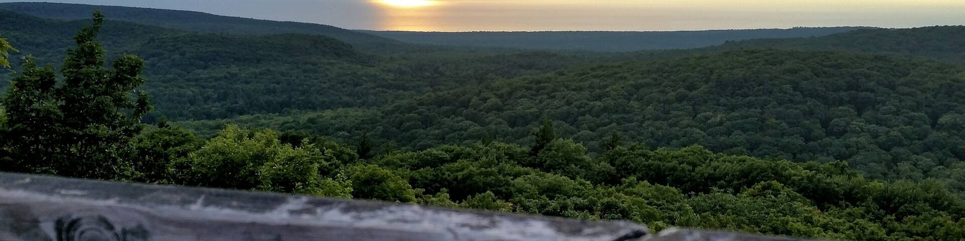 Between the wooden planks of the Summit Peak tower is an incredible view +1958 ft up. A must see just a dozen miles from the Porcupine Mountains visitors center.