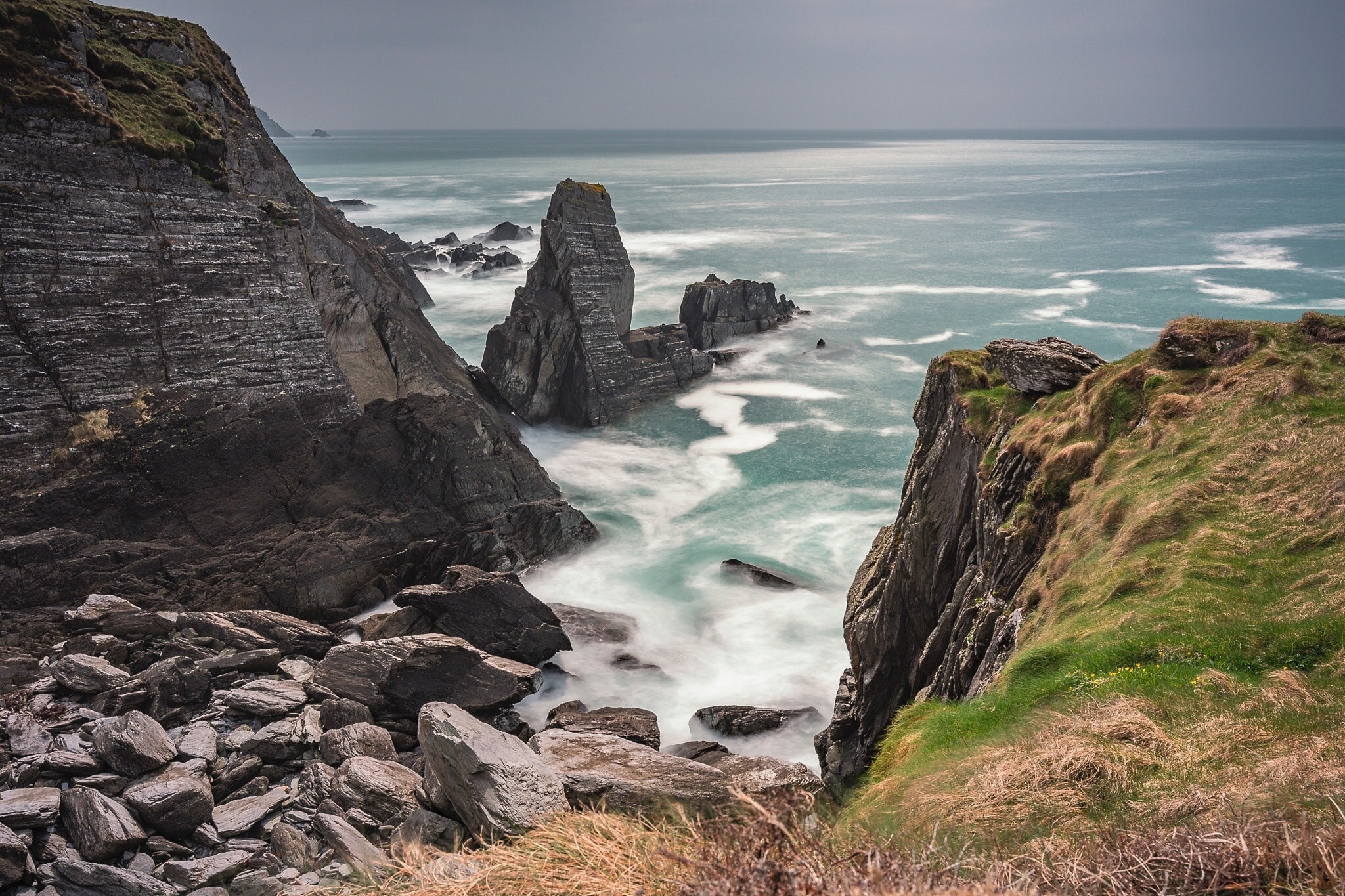 A little cove at 3 Castle Head on the Mizen Peninsular. Long Exposure to exaggerate the wave movements within the cove and on the surrounding rocks.