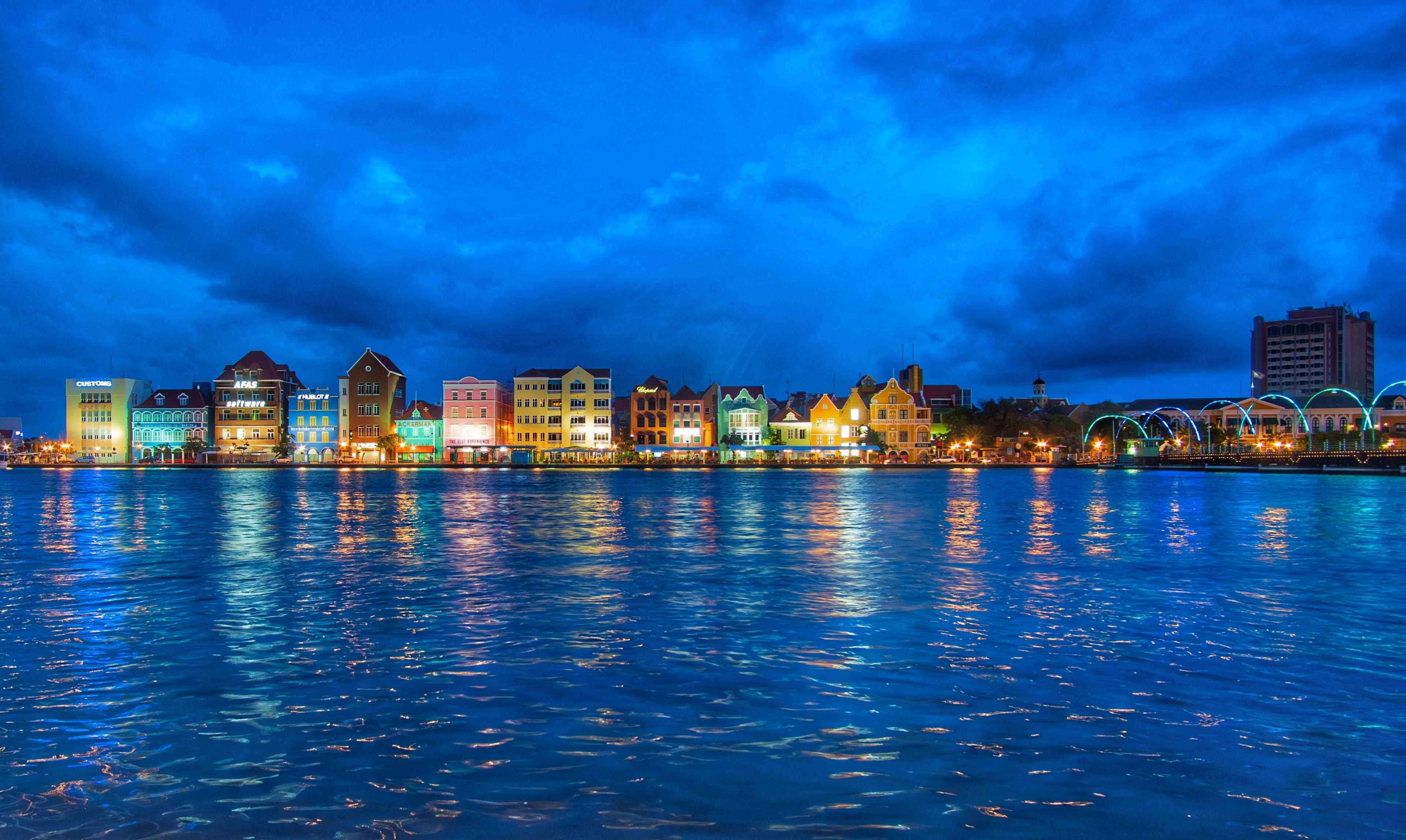 The harbor view in the port area of Willemstad at night