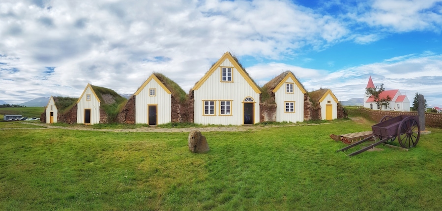 A beautiful collection of peat roofed buildings next to an attractive church in Glaumbær, Iceland
